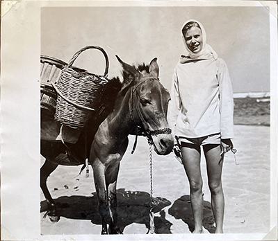 Carolina Matthews on Mykonos with a donkey.